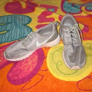 gray and light blue nike sneakers